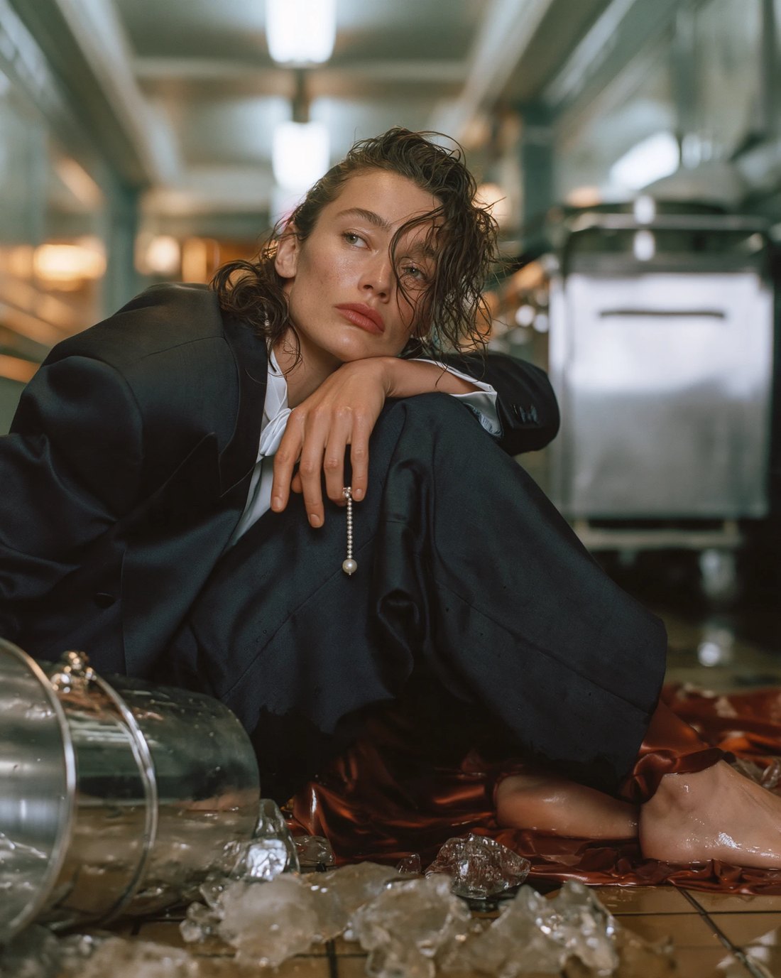 Tailored suit, wet floor and ice in a service corridor